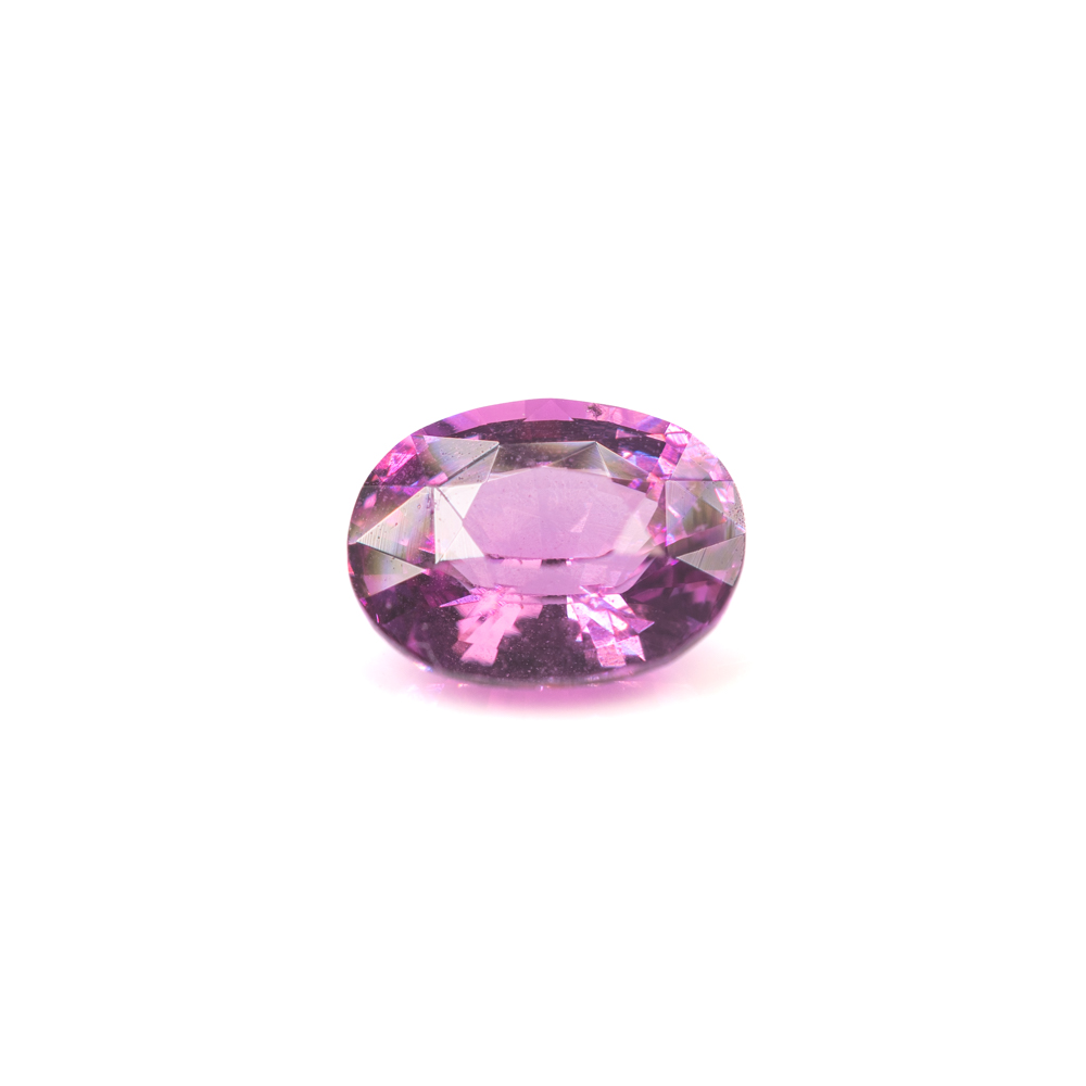 A high-quality oval-cut pink sapphire gemstone displaying exceptional clarity and a bright magenta hue.